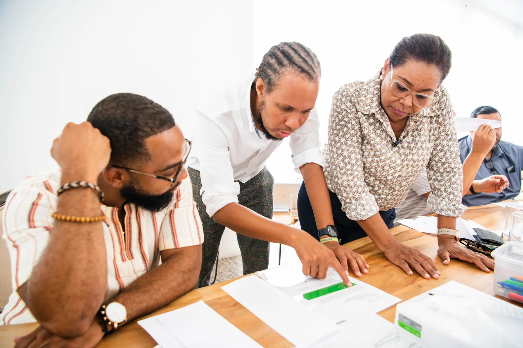 Adric Walter strategizing with his team